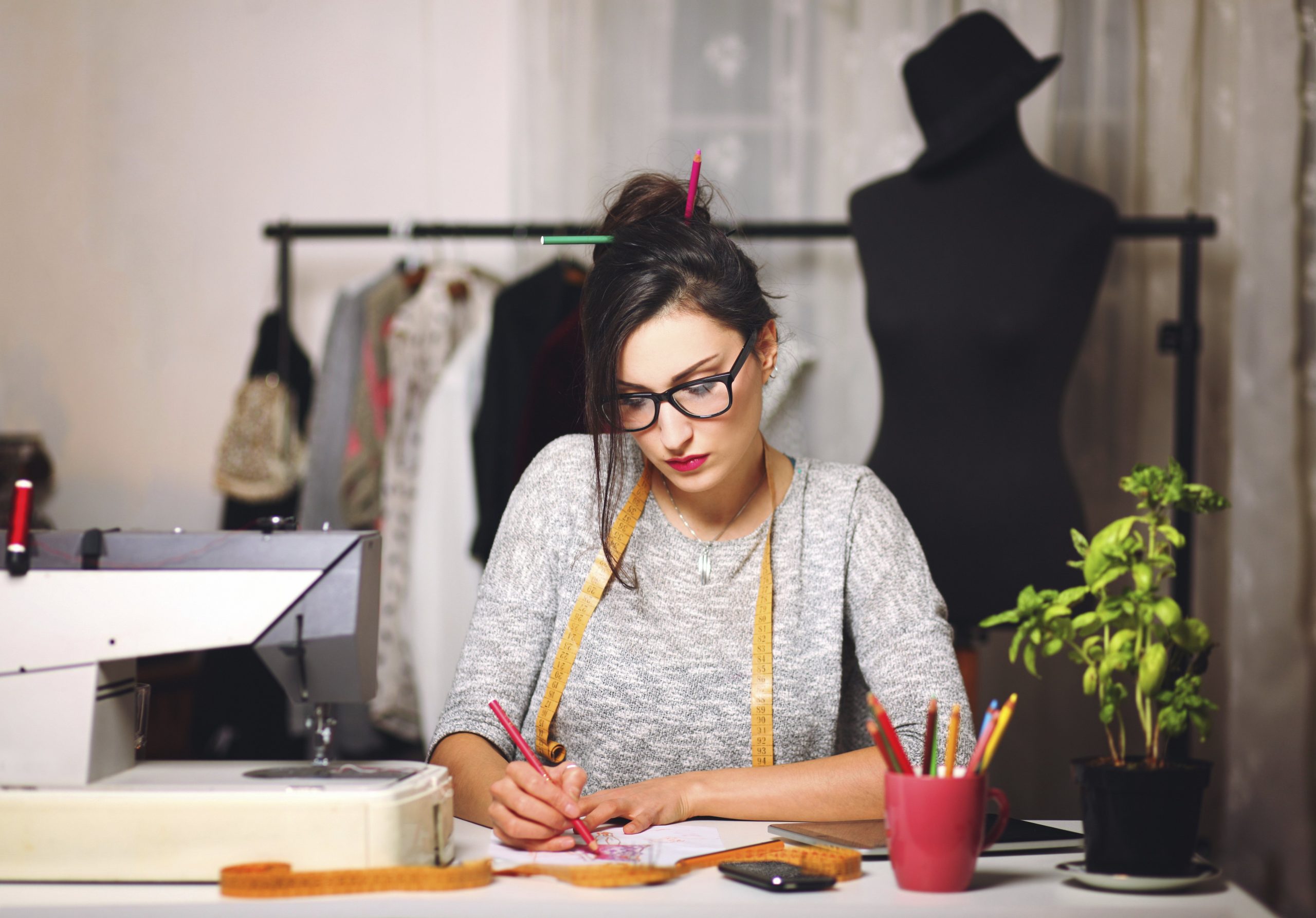 Young fashion designer working until late